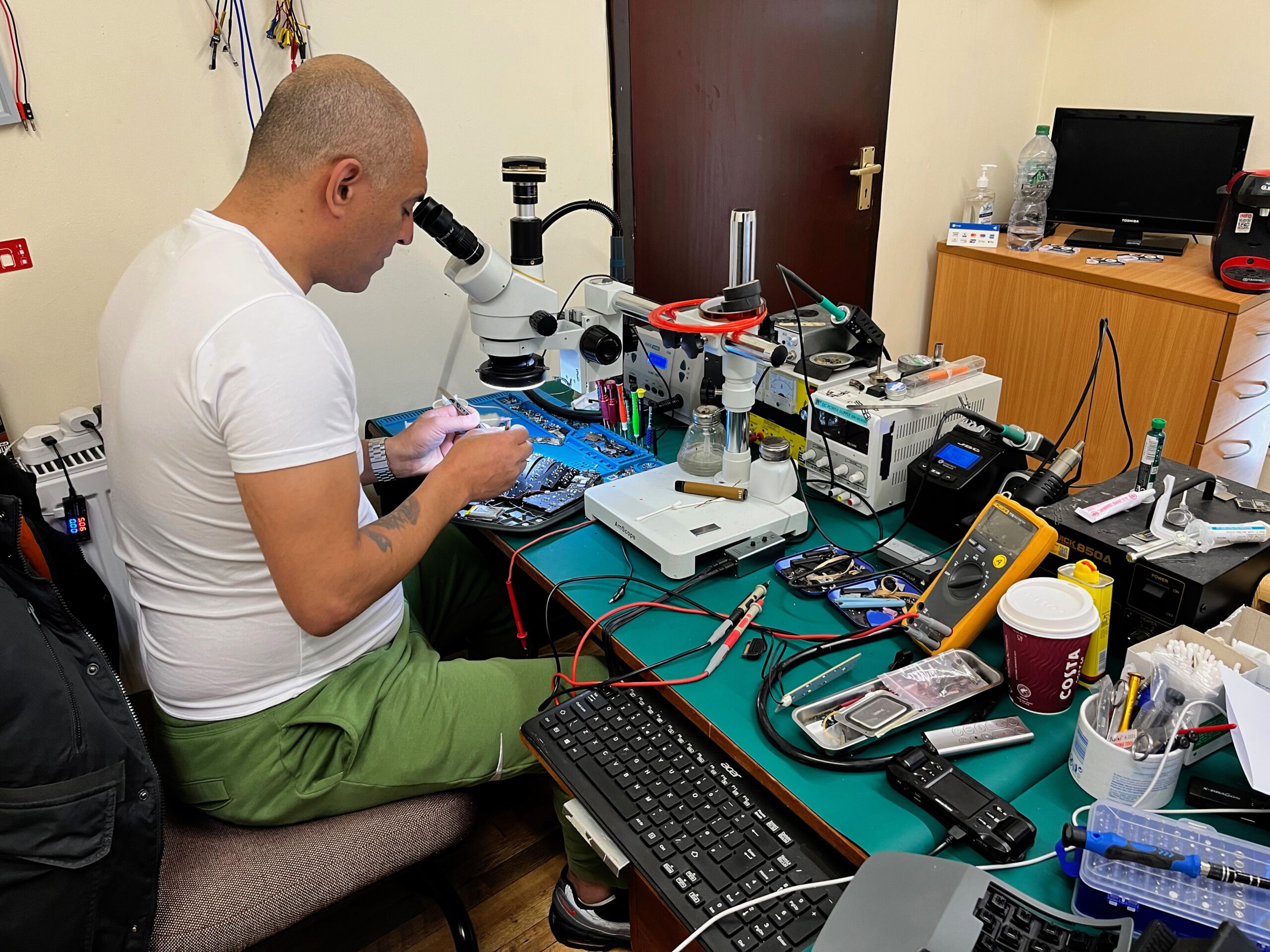 An expert fixes a PCB